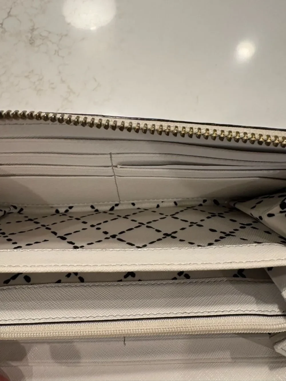 Kate Spade New York Cream Zip Wallet with Gold Plaque
